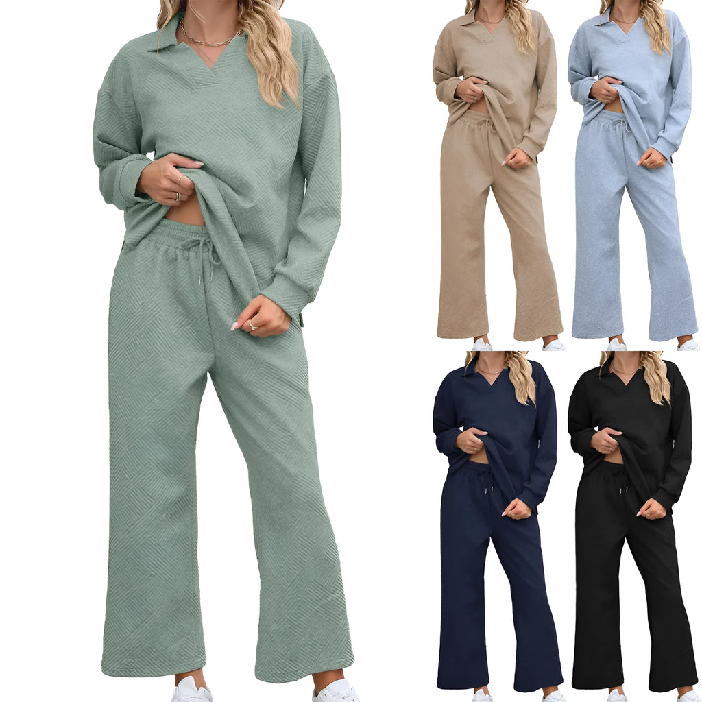 Women's solid colour knitted jacquard sweater and elastic waist trouser suit laid flat.