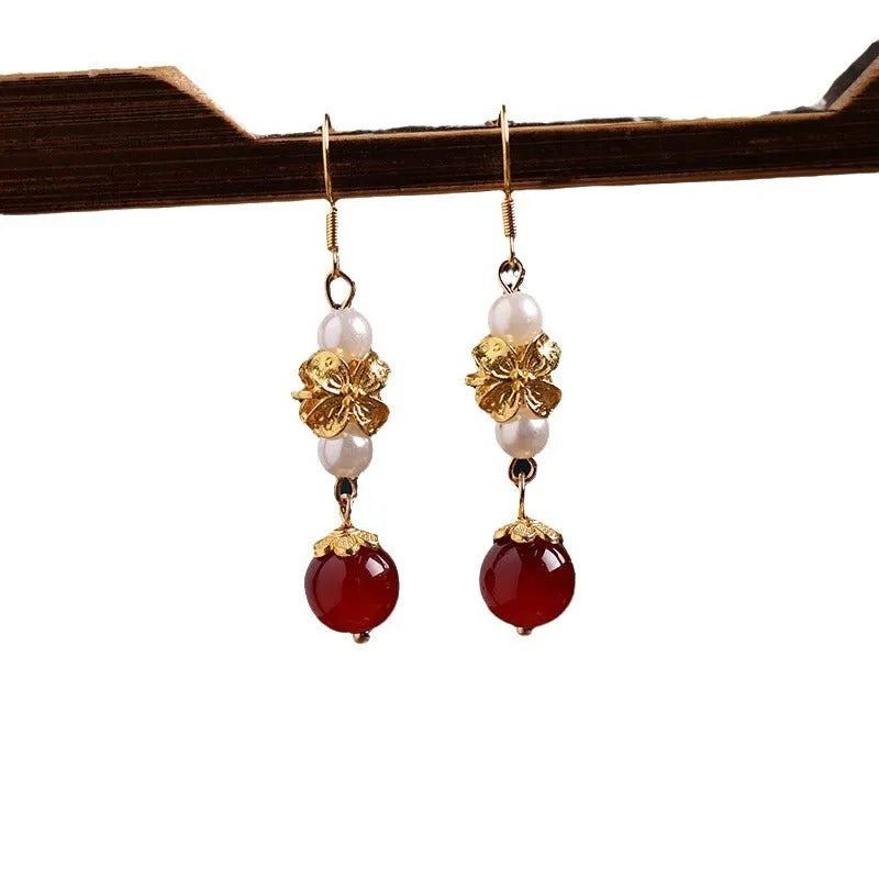 National Han Cheongsam antique earrings in geometric drop design with gold tone electroplated finish.