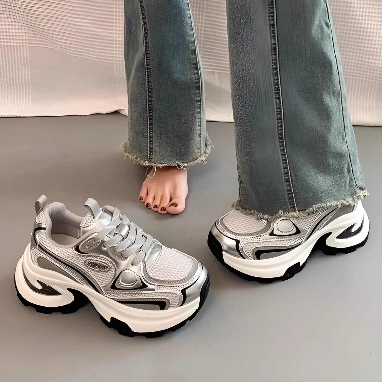 Women's red and silver clunky platform sneakers with mesh lining and rubber sole.