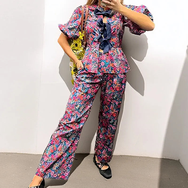 Women's floral printed trousers suit set with tie-neck puff sleeve top and matching trousers