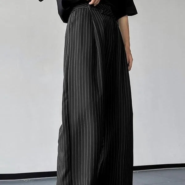 Men's black vertical striped pleated casual trousers showing elastic fabric detail