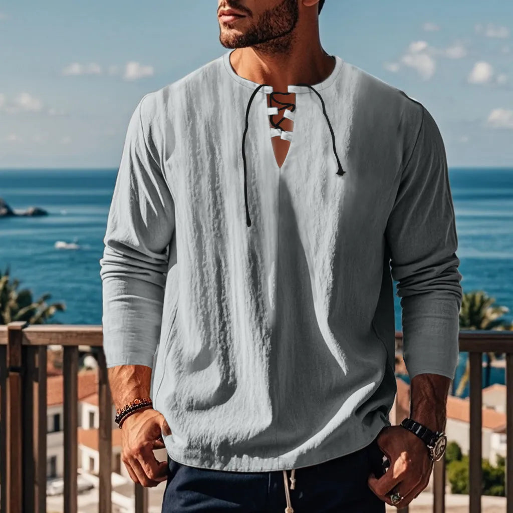Solid colour cotton linen beach ruff shirt in a loose pullover style.