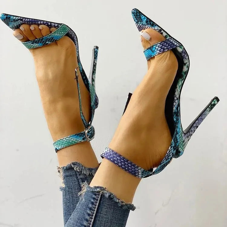 Blue women's high heel shoes with hollow out design and a buckle fastening.