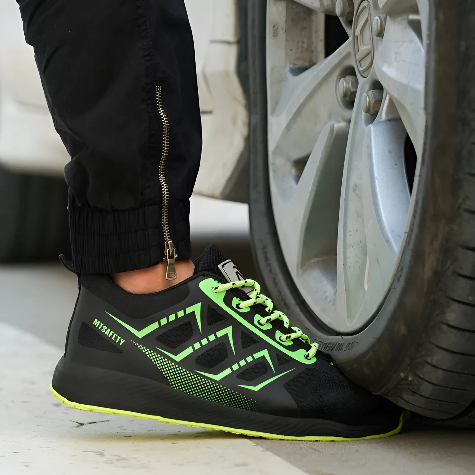 Black lightweight safety shoes with steel toe caps and lace-up front