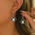 A pair of silver retro fashion alloy earrings for women with an electroplated finish.