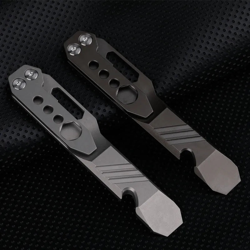 Titanium alloy multi-function crowbar tool with screwdriver tip and bottle opener in stone wash finish.
