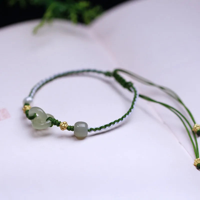 DIY woven bracelet with Hetian jade beads on a flexible wire band with silver or gold metal fittings.