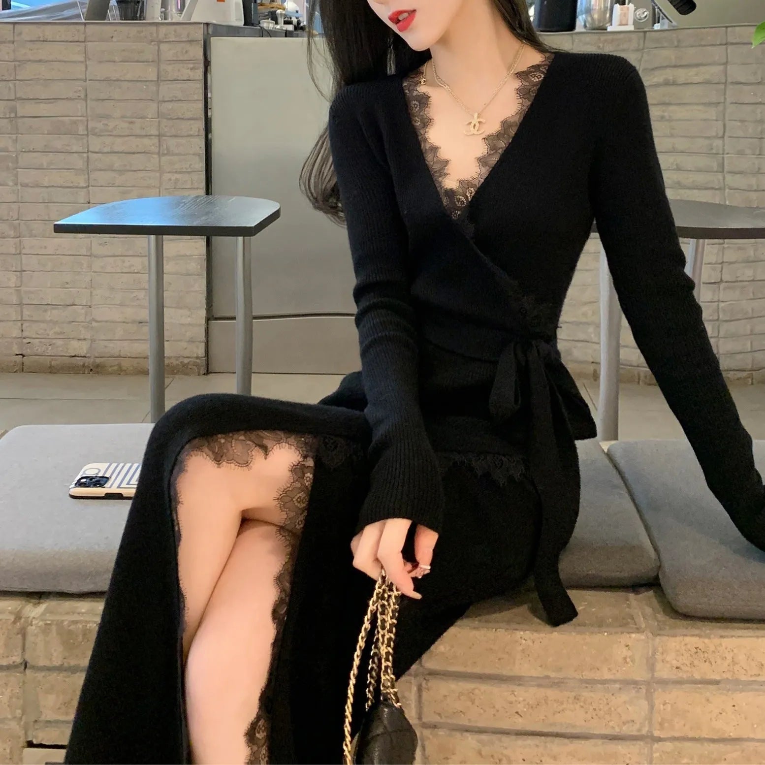 Black women's slim fit woolen skirt dress with a midi length and princess cut.