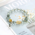 Green phantom quartz crystal bracelet with 8mm beads and gold accents in geometric ethnic style