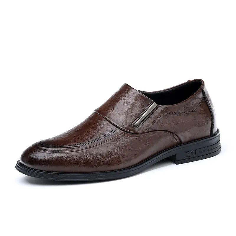 Men's black cowhide leather slip-on casual shoes with rubber sole on a plain background