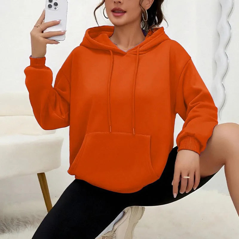 Women's loose grey drawstring hoodie with front pocket, laid flat.