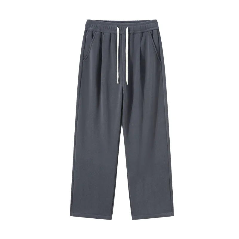 Men's apricot coloured double-sided polar fleece winter pants with a loose fit and drawstring waist.