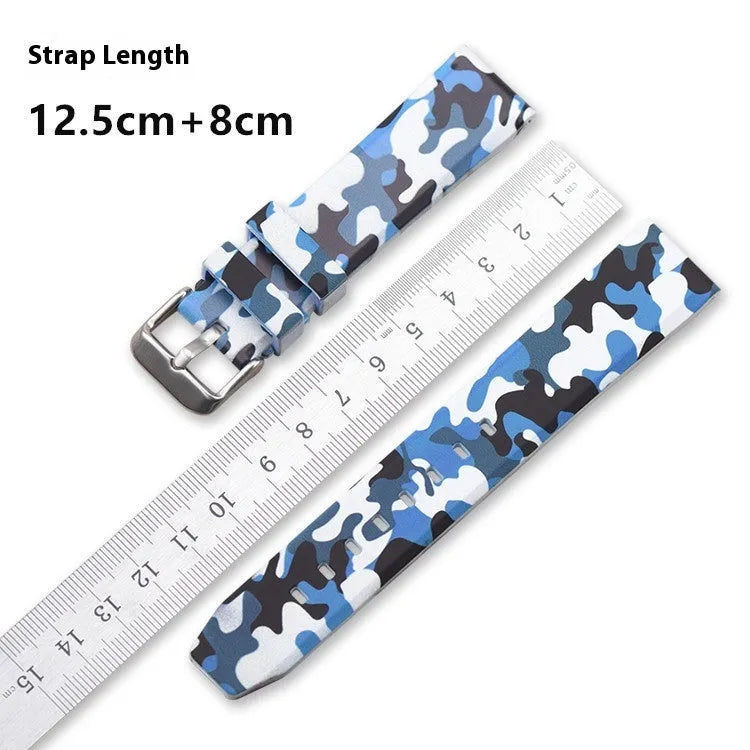 Green camouflage silicone watch strap with universal flat head lugs on a grey background.
