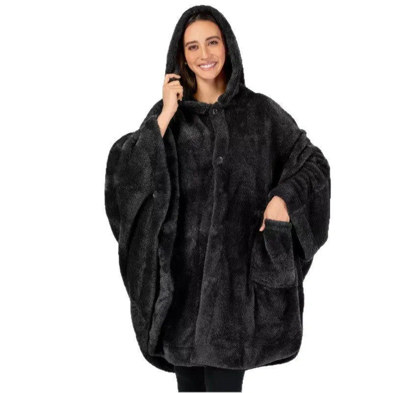 A thick pink hooded bathrobe with long sleeves and a cardigan-style front on a hanger.
