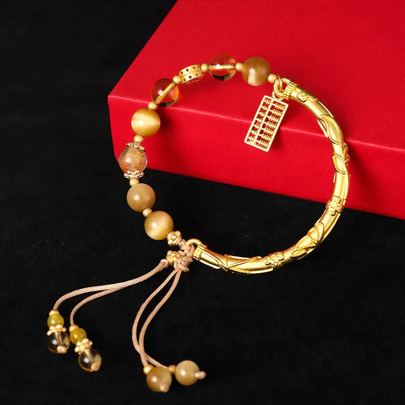 Women's abacus tag bracelet with tigereye and citrine beads and copper diamond-shaped tag