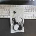 Black motorcycle helmet Bluetooth headset with large volume stereo and waterproof design on a dark background