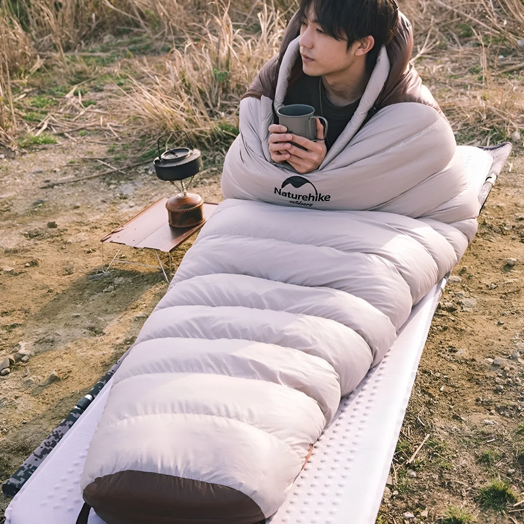 Goose down mummy sleeping bag for adult camping in cold weather with storage bag