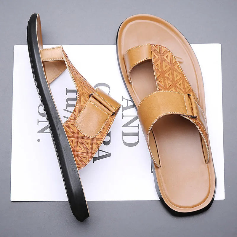 Men's light brown open-toe beach slippers made from cowhide leather with a rubber sole.