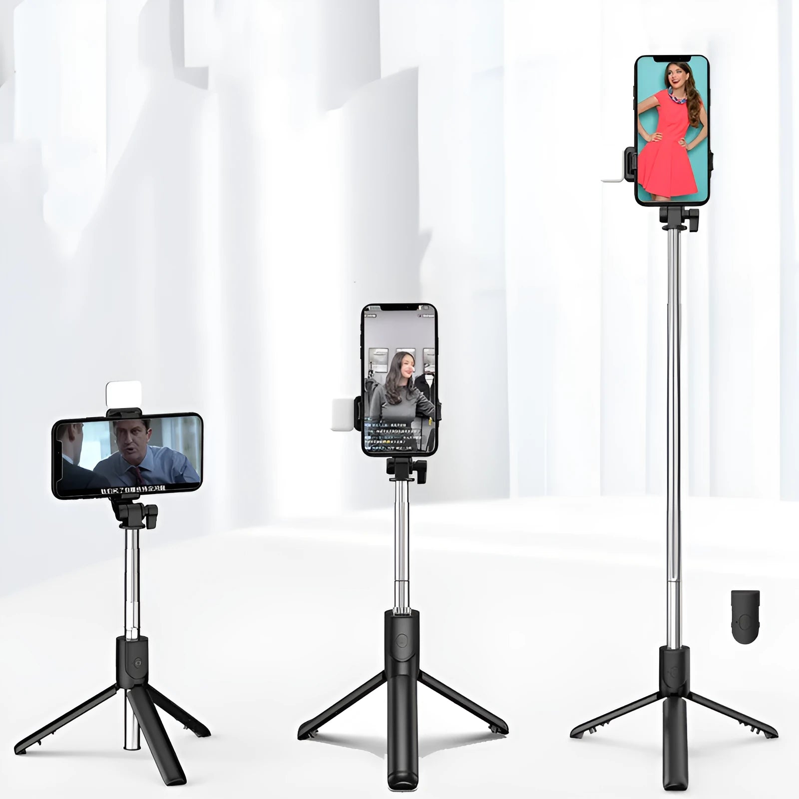 Aluminium alloy Bluetooth selfie stick with integrated tripod legs and 360-degree rotating phone holder in black.