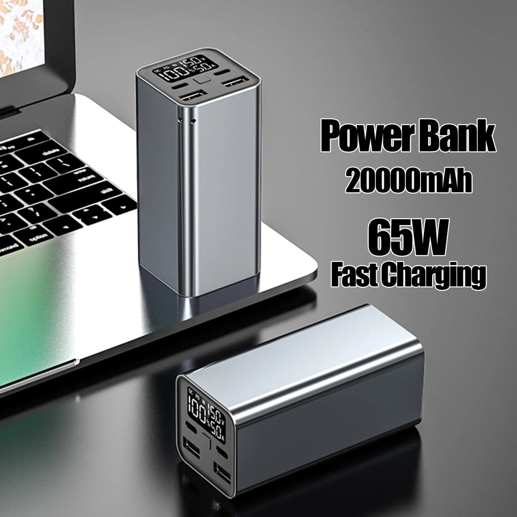 A black 65W high power laptop charging bank with a metal case, showing its dimensions.