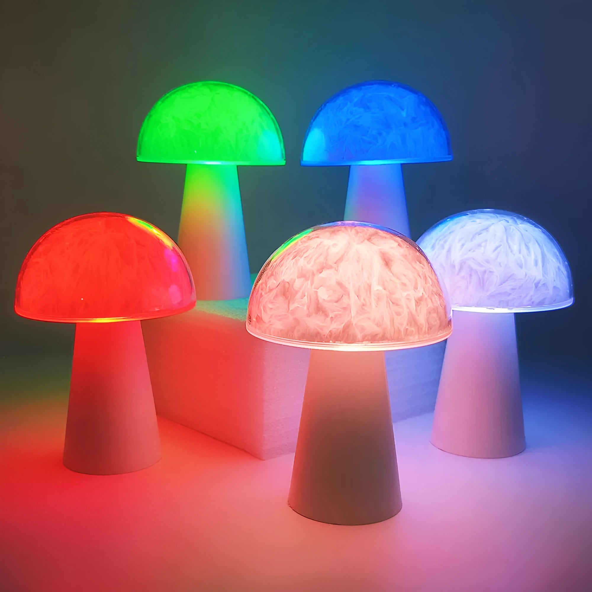 White mushroom-shaped night light with remote control on a wooden surface, showing soft RGB glow.
