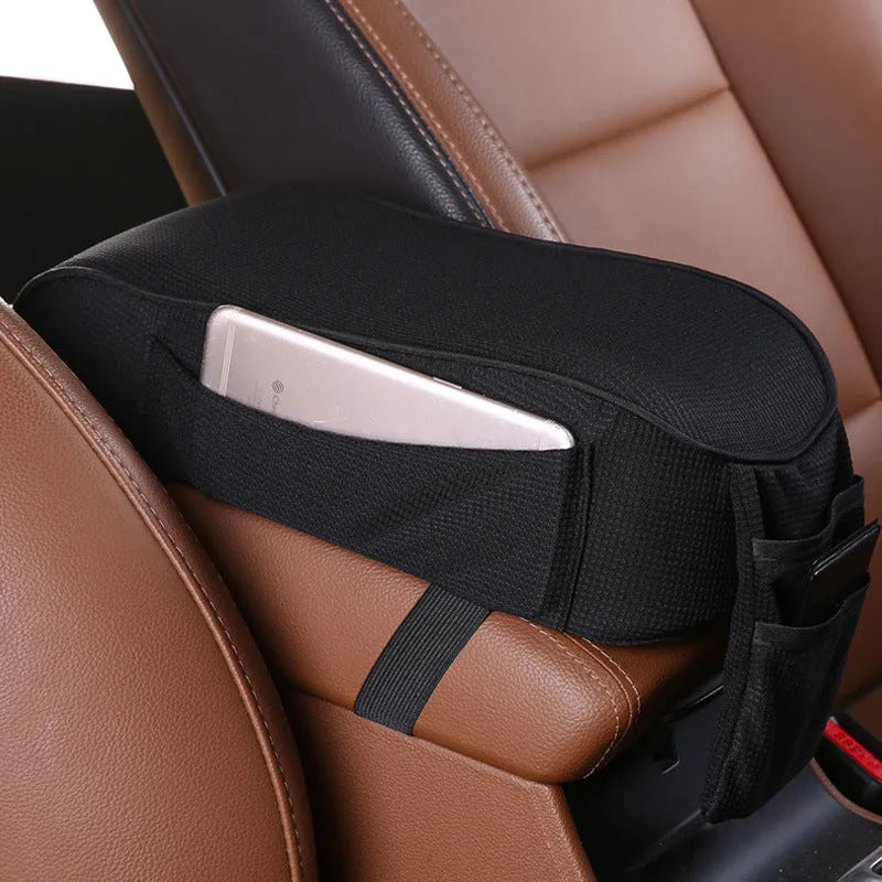 Sports knitted fabric car armrest box pad in Black Red colour on a car centre console. Measures 16x30cm.