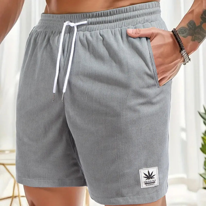 Man's drawstring waist summer shorts in blue, showing straight leg and casual fit