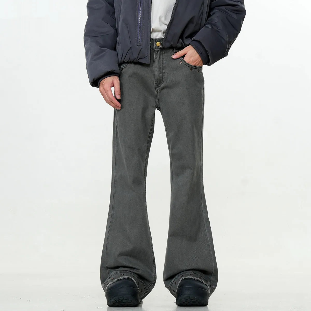 Straight-leg cotton jeans on a hanger, showing mid-waist fit, zipper fly, and horn-style leg opening.