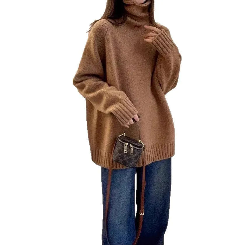 Women's loose grey turtleneck sweater with thick textured pile collar, casual style.