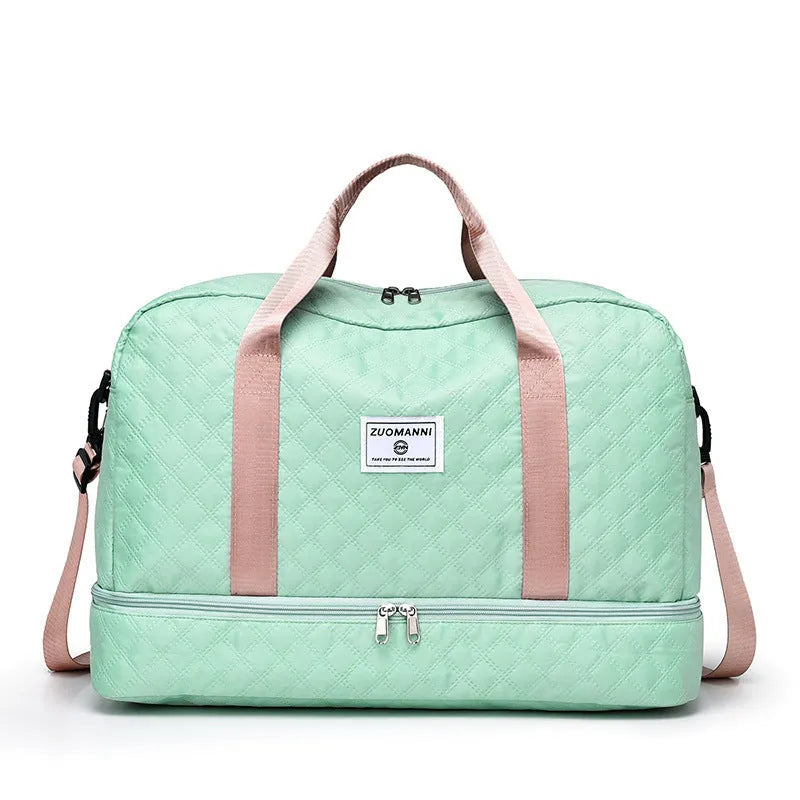 Large oxford cloth travel bag in a solid colour with visible sewing thread details, shown with the main compartment open.