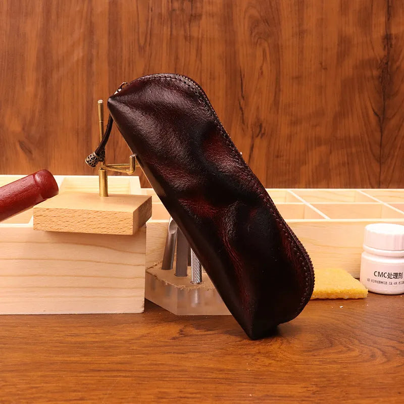 Leather glasses buggy bag in first layer cowhide with belt clip, shown in black, burgundy, brown or light brown.