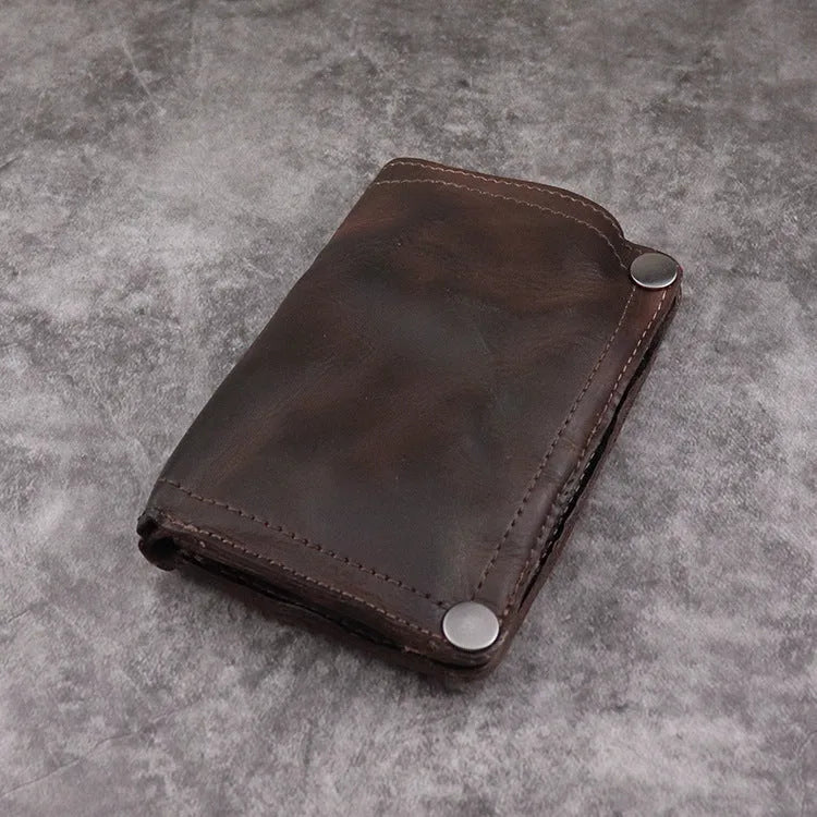 Men's retro style vertical long wallet in genuine cowhide leather showing multiple internal card slots and compartments.