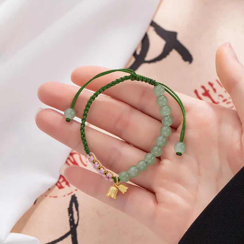 Red rope hand woven bracelet with lily carrying strap design in national style for women