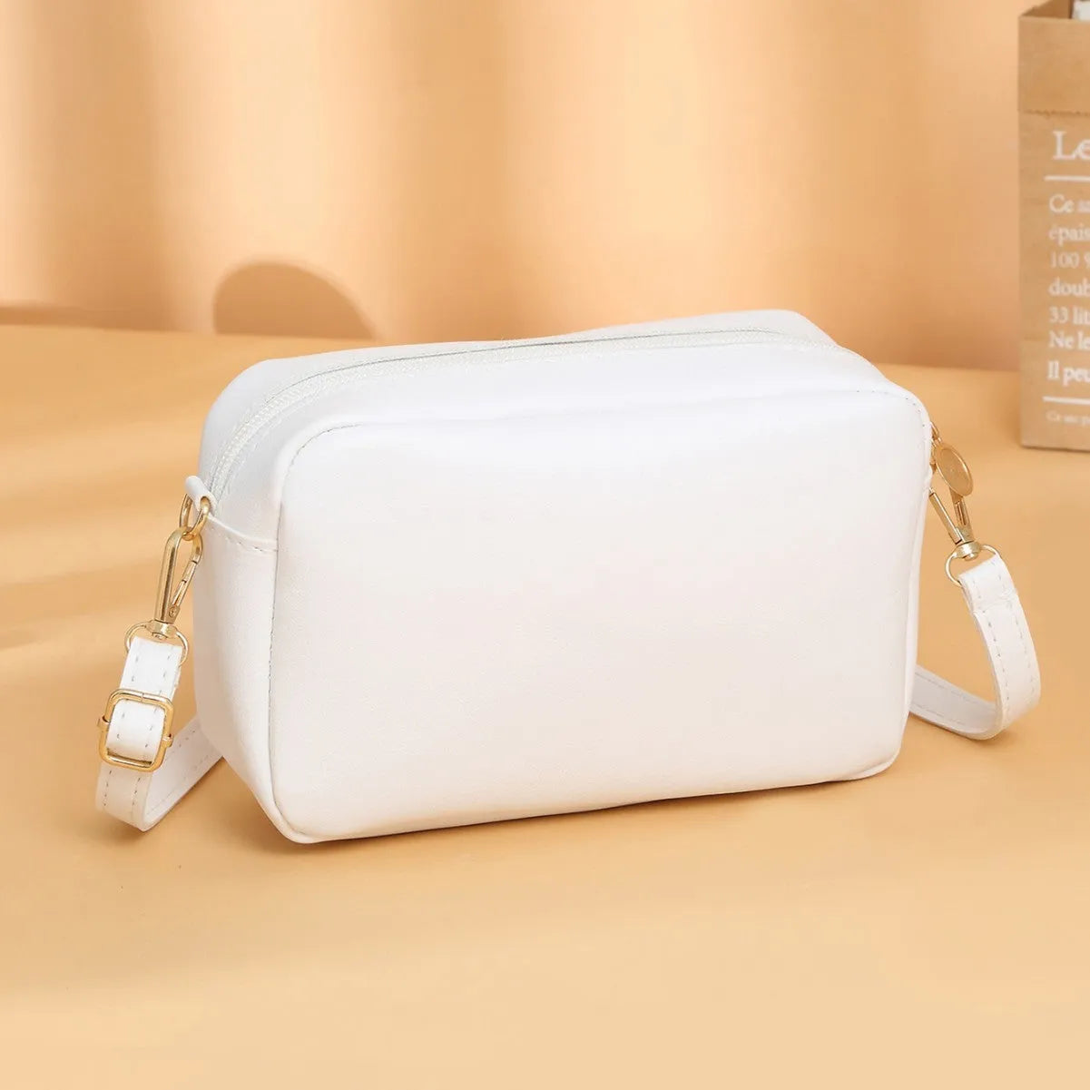 Solid colour PU ladies' shoulder bag in horizontal square shape with three-dimensional pocket.
