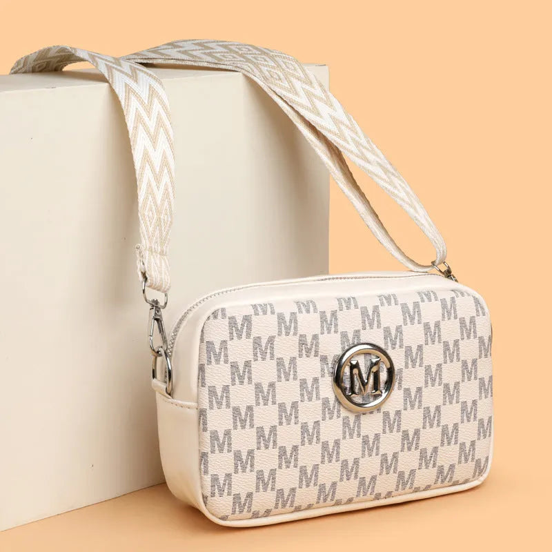 PU leather crossbody bag with wide adjustable strap and three-dimensional pocket in black colour