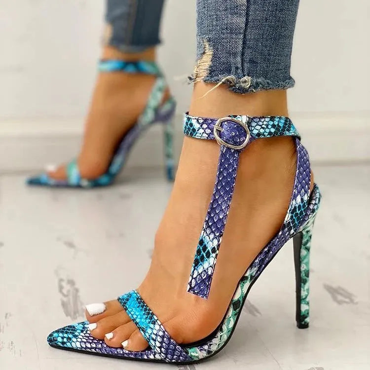 Blue women's high heel shoes with hollow out design and a buckle fastening.