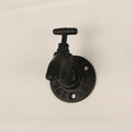 Wall-mounted metal water pipe style towel hook in a modern design