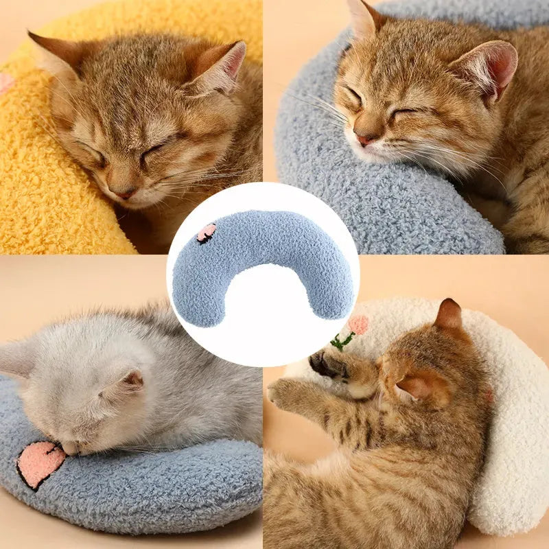 Small U-shaped plush pet pillow in blue for a cat or small dog to sleep on.