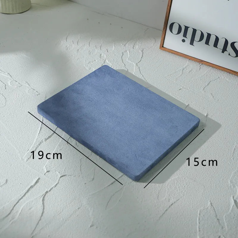 Flannel jewellery display stand in light blue with gypsum base showing 15cm round plate