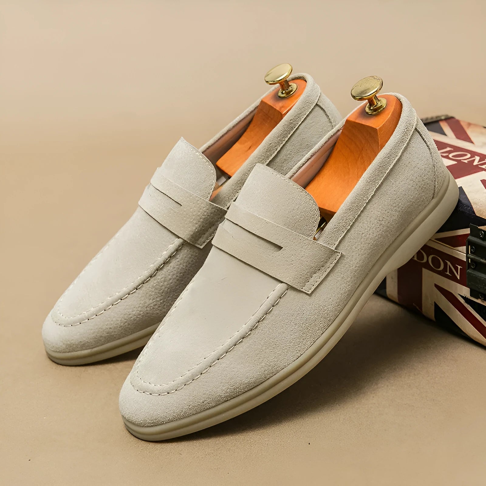 Men's black slip-on leather shoes with oversleeve design and rubber sole.