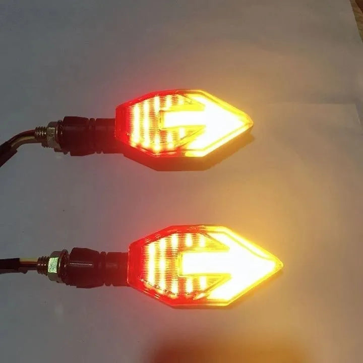 Arrow-shaped LED motorcycle turn signal light with ABS plastic housing for 12V systems.