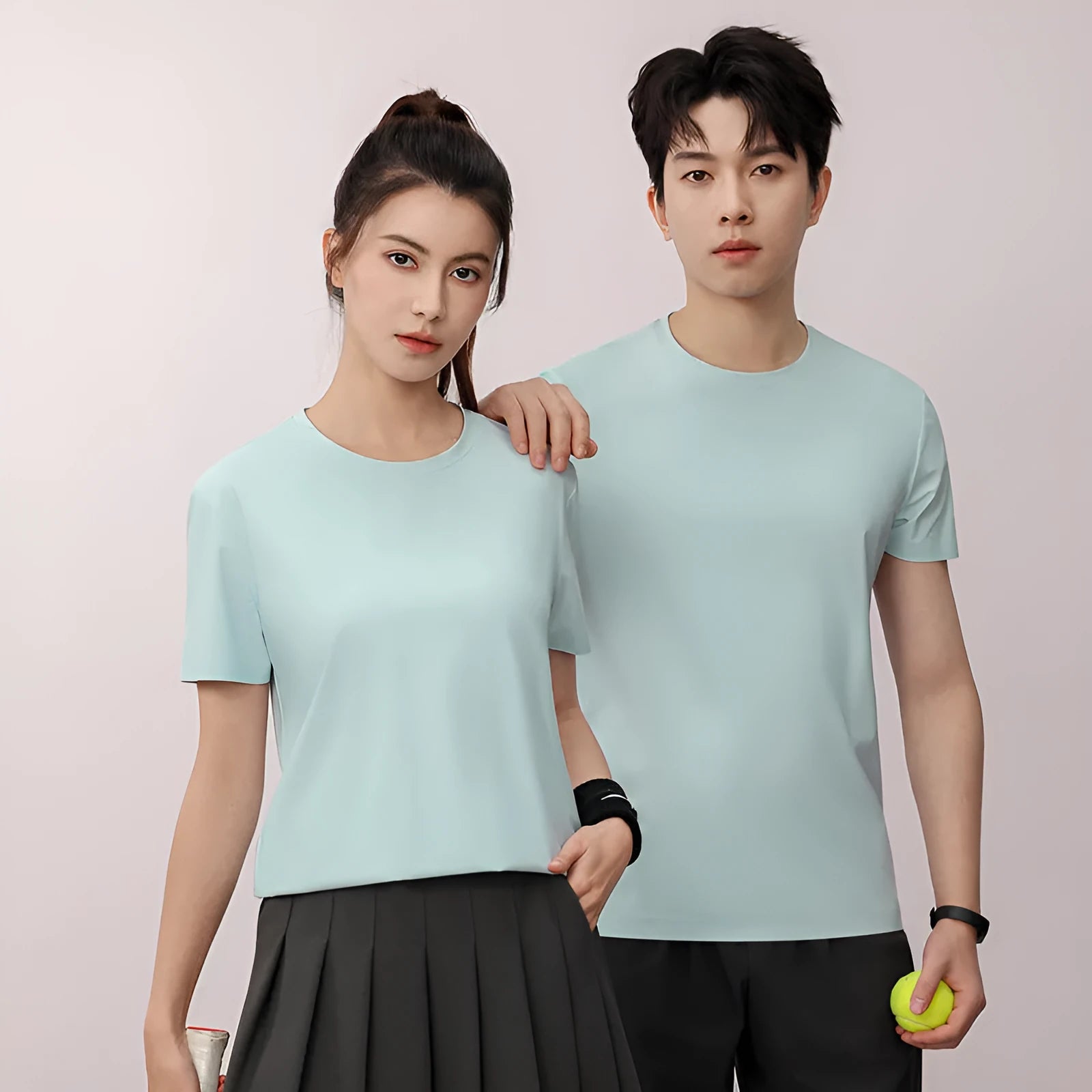 Man wearing a slim fit Ice Silk quick-dry T-shirt in apple green, showing short sleeves and casual style.