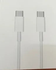 White 20W USB-C UK wall charger with a fixed three-pin plug and a USB-C cable.