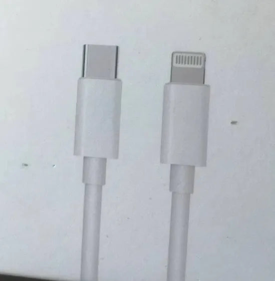 White 20W USB-C UK wall charger with a fixed three-pin plug and a USB-C cable.