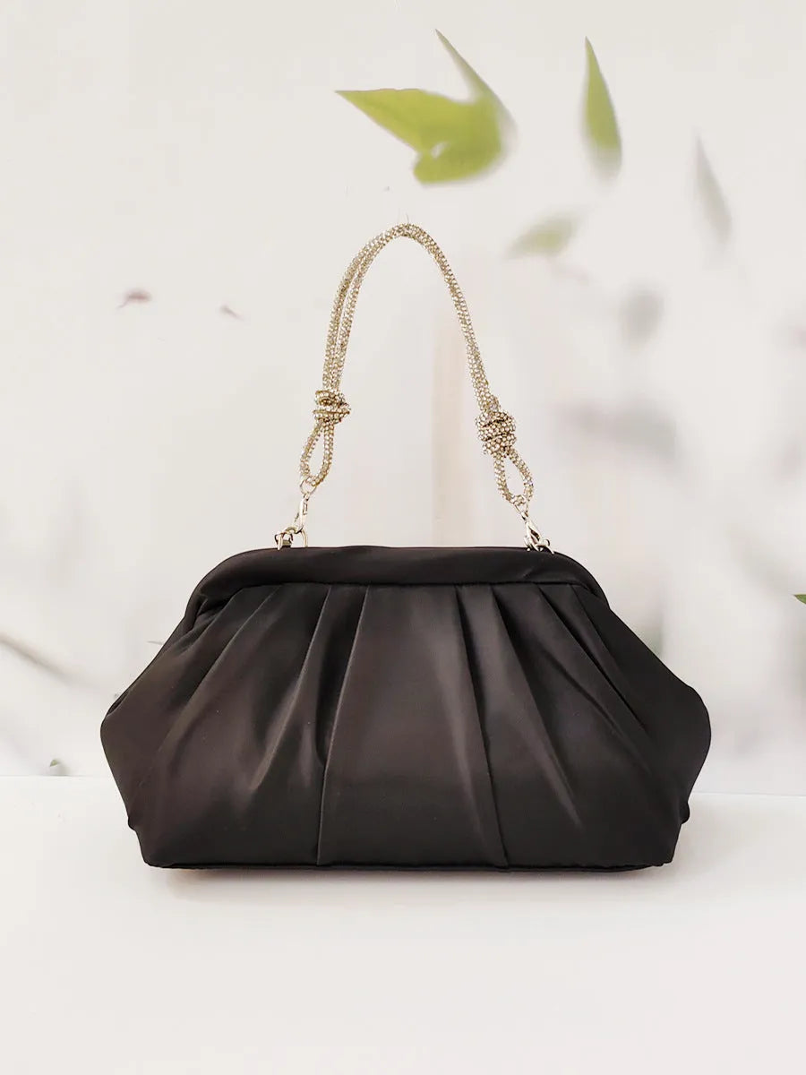 Women's soft polyester dinner messenger bag in lavender purple showing fold, diamond, and chain details.