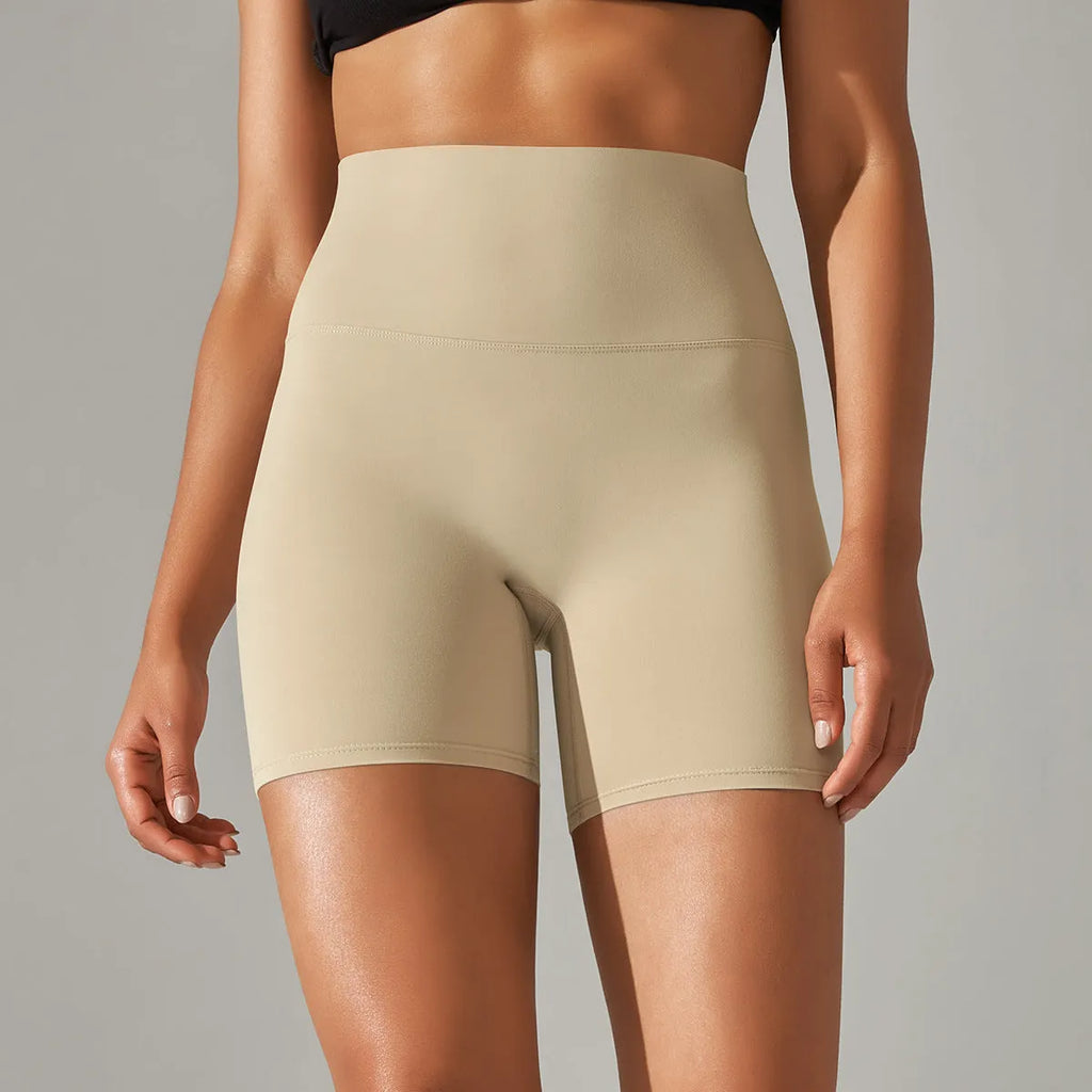 Women's high waist fitness tights in dark green, hip-length cut, for running and gym wear.