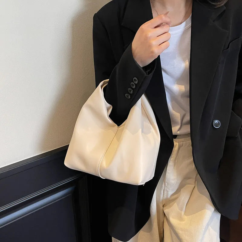 Women's casual PU leather foldable dumpling handbag in multiple colours showing sandwich pocket.