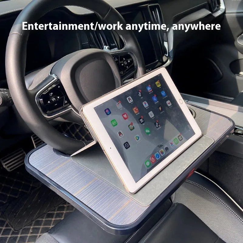 Foldable black car laptop table with built-in cup holder mounted on steering wheel
