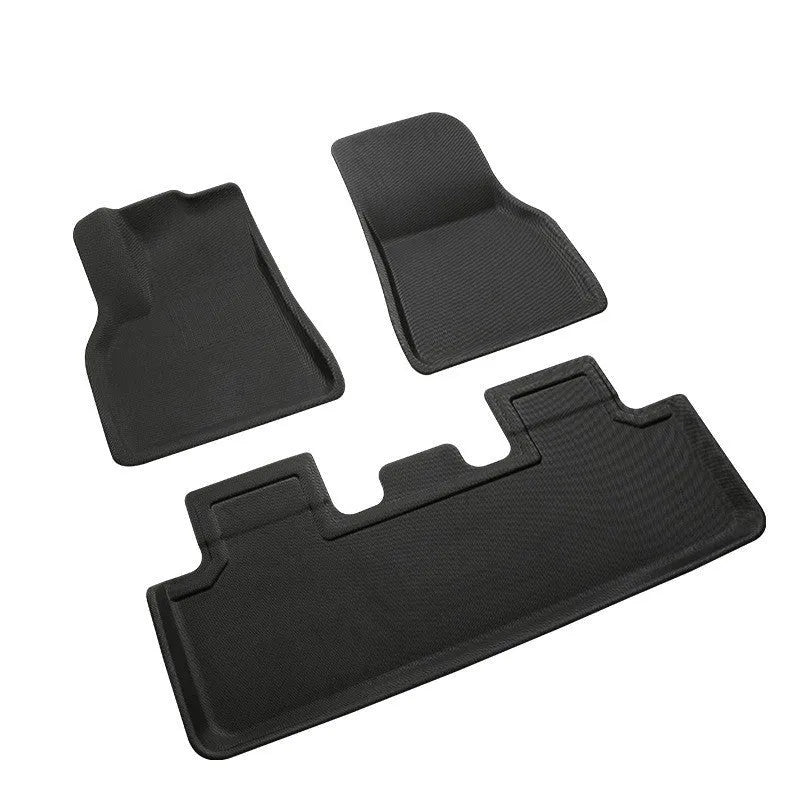 Custom TPR floor mat set for Tesla Model Y showing footwell, storage box, and tailbox mats.