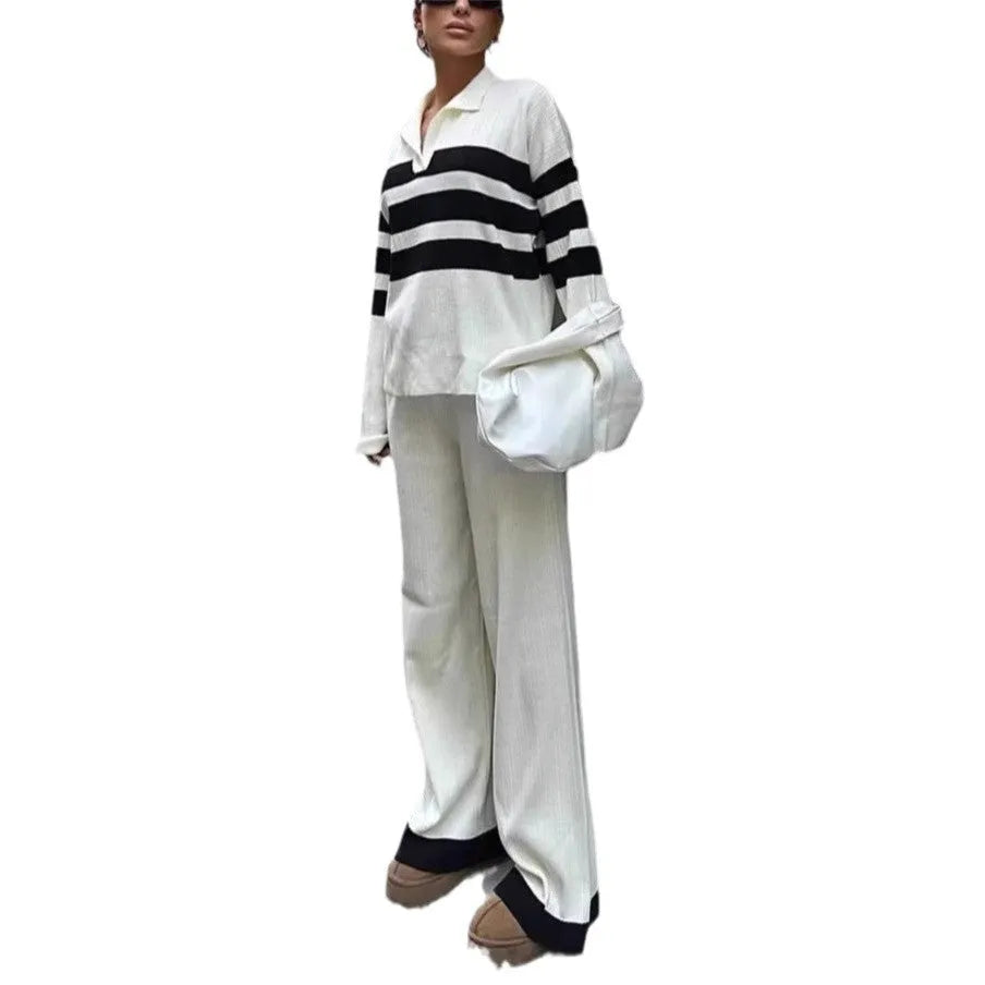 Women's black and white striped knitted polo collar two-piece set with long sleeves and trousers.